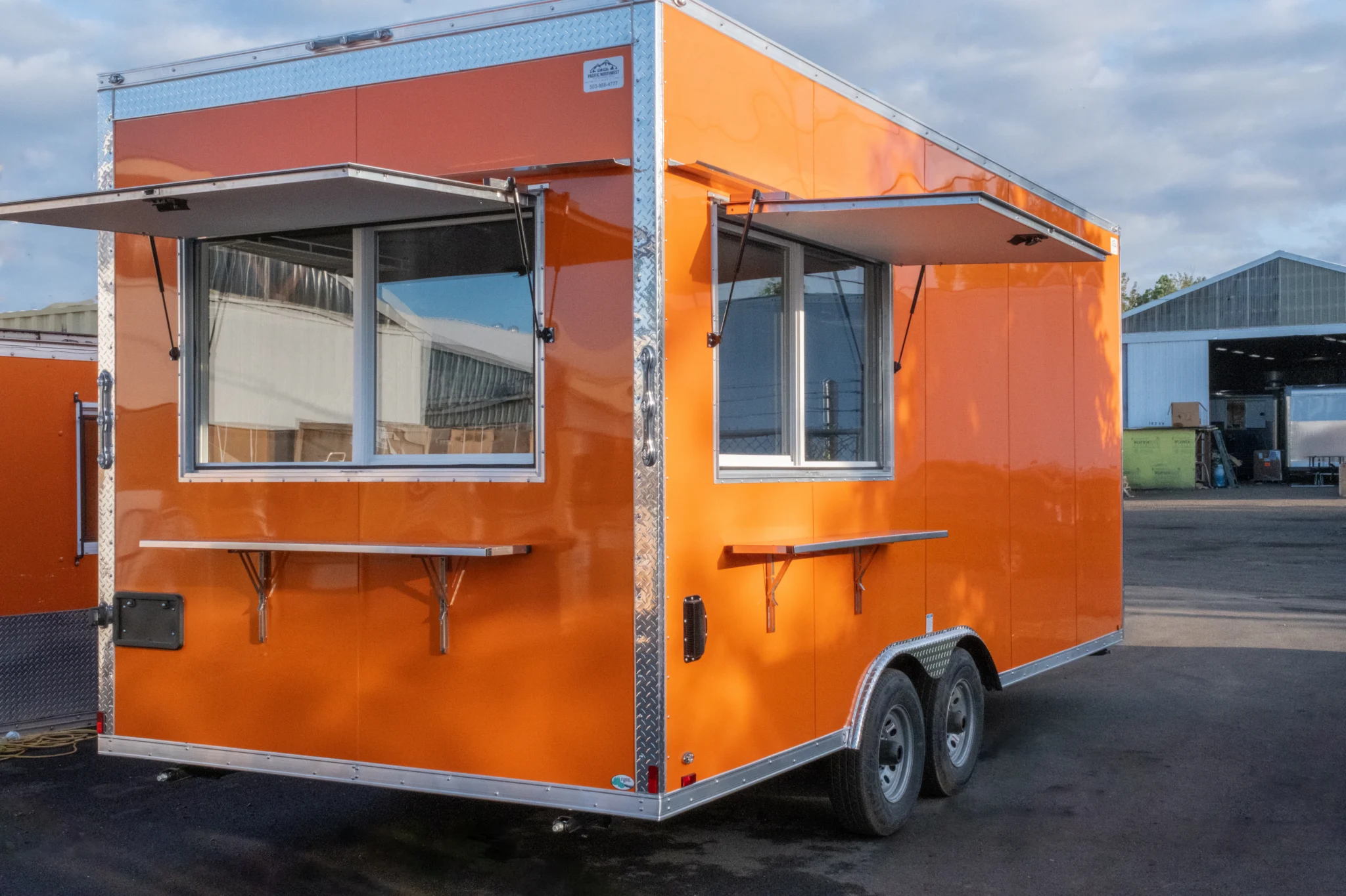 Fully customized food trailer with serving counter and commercial cooking appliances